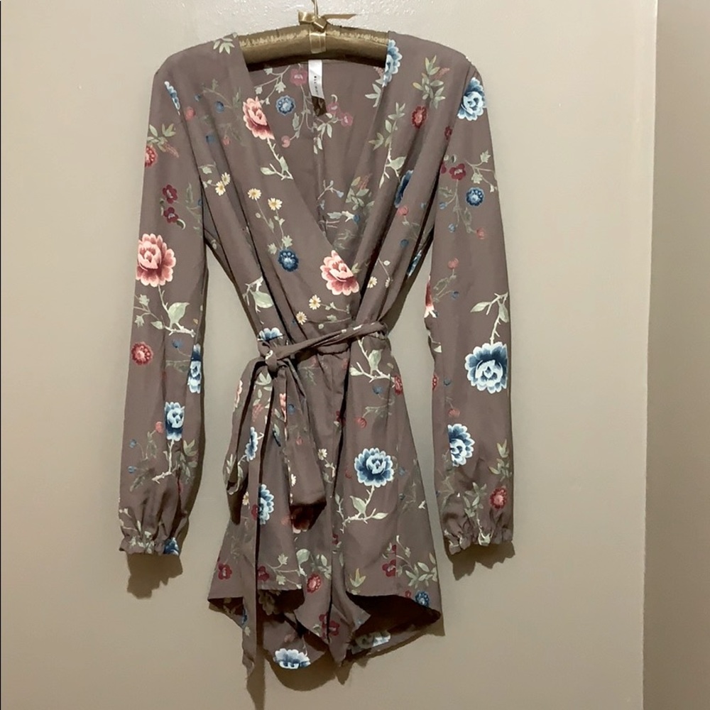 Romper with belted waist and lined top.